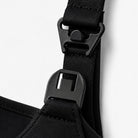 Close-up of black straps with buckles on a white background